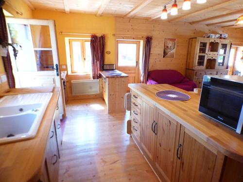 a kitchen and living room of a tiny house at Chalet Hauteluce, 3 pièces, 8 personnes - FR-1-594-63 in Hauteluce