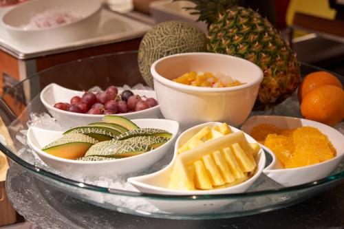 a tray filled with different types of fruits and vegetables at Shibuya Tokyu REI Hotel in Tokyo