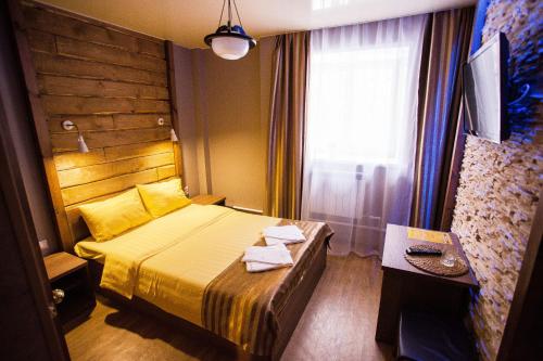 Un ou plusieurs lits dans un hébergement de l'établissement Hotel Kochevnik na Limonova