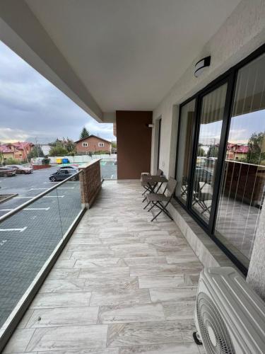 a balcony with benches on a building with a street at Chic apartament complex Inamstro in Iaşi