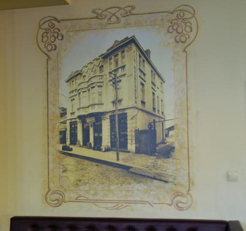 a picture of a building in a frame on a wall at Family Hotel Chiplakoff in Burgas City