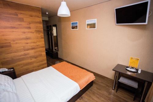 Hotel Kochevnik na Zherdeva tesisinde bir odada yatak veya yataklar