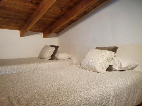 Postel nebo postele na pokoji v ubytování Casa Rústica Charco del Viento