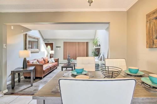 a living room with a table and a couch at Waterbury Home Playground and Porch Swing in Waterbury