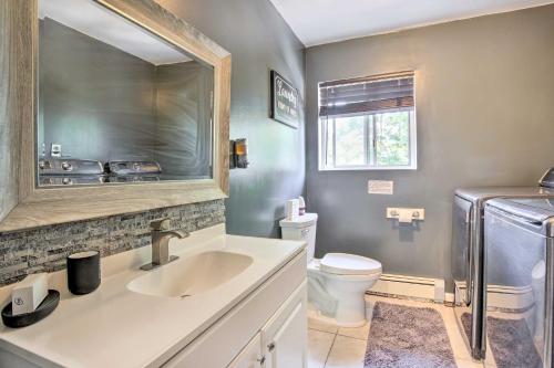 a bathroom with a sink and a toilet at Waterbury Home Playground and Porch Swing in Waterbury
