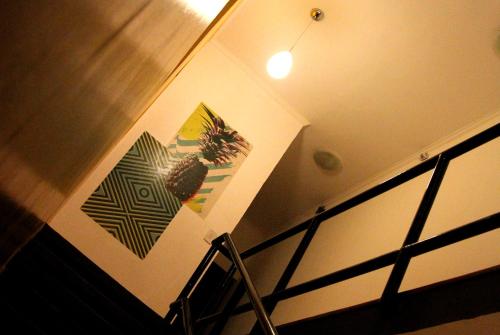 a staircase with a potted plant on the wall at Soul Hostel Av Paulista Bela Vista 1 in Sao Paulo