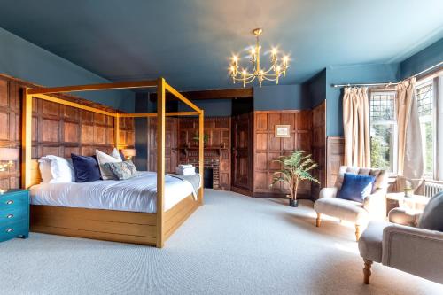 a bedroom with a canopy bed and a couch at The Beacon in Whitby