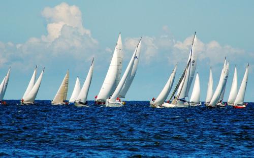 a group of sailboats in the ocean on the water at POLANKI AQUA Apartamenty PREMIUM - w cenie nielimitowany dostęp do strefy Aqua in Kołobrzeg