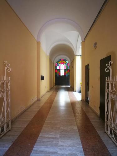 a hallway in a building with a stained glass window at CA' POMPOSA bed & relax in Modena