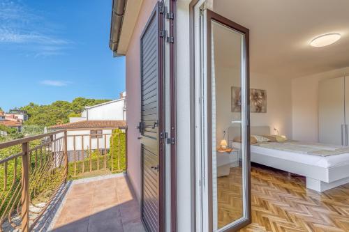 Postel nebo postele na pokoji v ubytování Apartment Complex Silva Rovinj