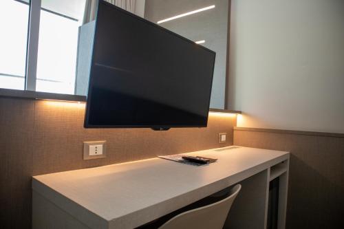 TV a/nebo společenská místnost v ubytování Poggio Hotel