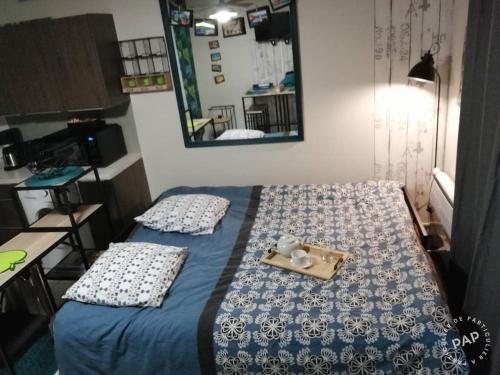 Ένα ή περισσότερα κρεβάτια σε δωμάτιο στο Au calme, 100m plage Écluse, balcon, box garage, Wifi