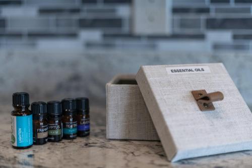 a group of four bottles of essential oils next to a box at Stunning Views + Hot Tub + Location! 3 bed/3 bath in Cottonwood