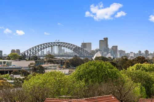 a view of the sydney opera house and the harbour bridge at BROUG10W - City View Studio in Sydney
