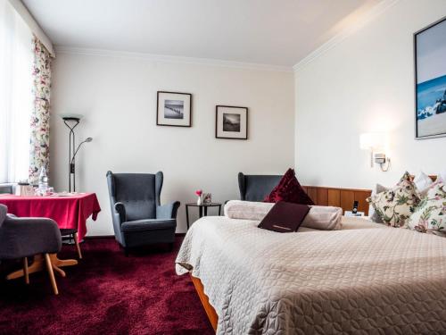 Postel nebo postele na pokoji v ubytování Garni Hotel & Appartements Nordstrand