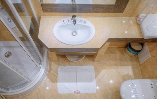 an overhead view of a bathroom with a sink and a shower at Dolina Chocholowska in Kościelisko