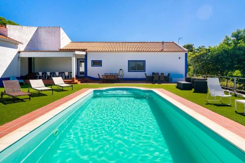 a swimming pool in the yard of a house at Chaparral Wonderful house in Nature 1h from Lisbon by Soulplaces in Silveiras