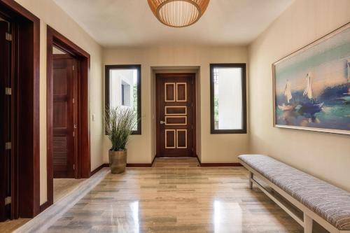 a hallway with a couch and a painting on the wall at 3BR apartment with balcony in Portillo - Terrenas in Las Terrenas