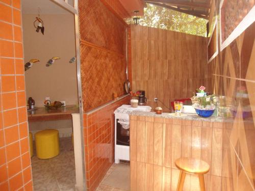 A kitchen or kitchenette at Hostel do Tucano