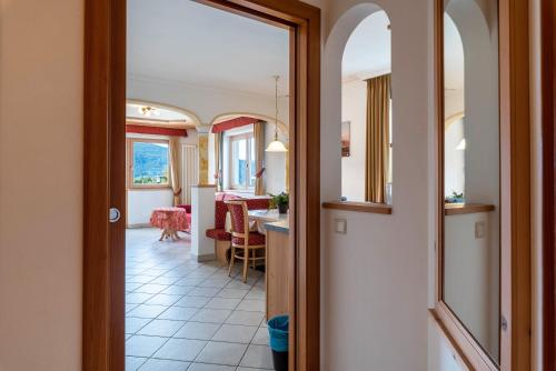 a hallway with a door leading to a dining room at Residence Diana Apartment 103 in Terento