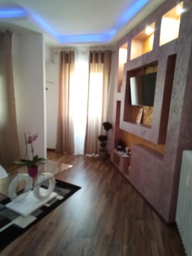 a bathroom with a toilet in the middle of a room at Katrin luxury in Verona