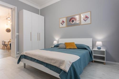Un pat sau paturi într-o cameră la Casa Olympic in Santa Rita by Wonderful Italy