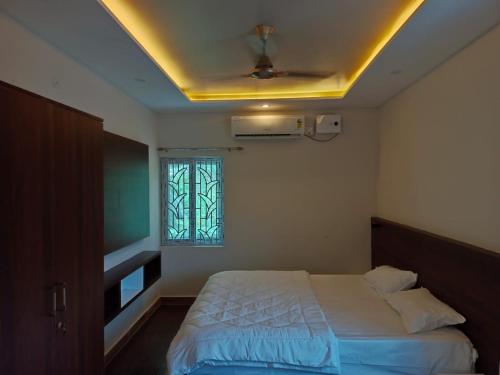 Postel nebo postele na pokoji v ubytování The green pride resorts