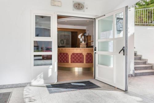 an open door of a house with aoyer at Residence Diana Apartment 402 in Terento