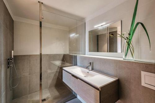 a bathroom with a sink and a shower at Infiniti 1 BR Private Luxury Villa Breath Taking View in St Barth in Pointe Milou