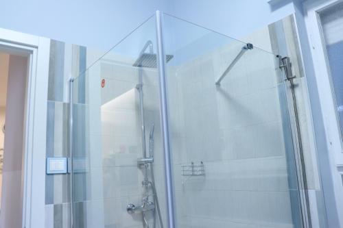 a shower with a glass door in a bathroom at Due Passi dal Mare in Pescara