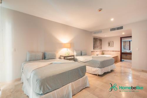 Säng eller sängar i ett rum på Ocean View 1 BR Apartment at Punta Palmera DB7