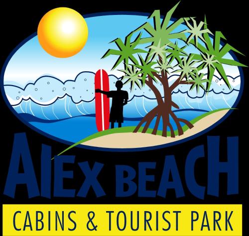 a man holding a surfboard on a beach with a palm tree at Alex Beach Cabins and Tourist Park in Alexandra Headland