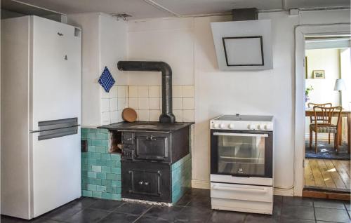 a kitchen with an old stove in a room at 1 Bedroom Cozy Home In Eslöv in Eslöv