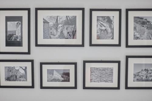 a group of pictures hanging on a wall at Guest House Marija in Bol