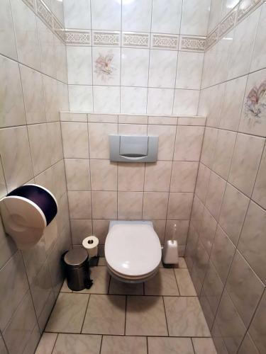 a small bathroom with a toilet and a trash can at Landrasthaus Maria Bild in Maria Bild