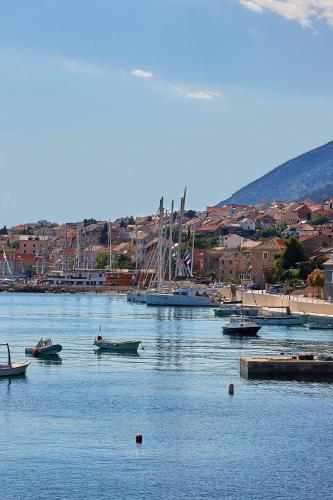 a group of boats in the water near a harbor at Guest House Marija in Bol
