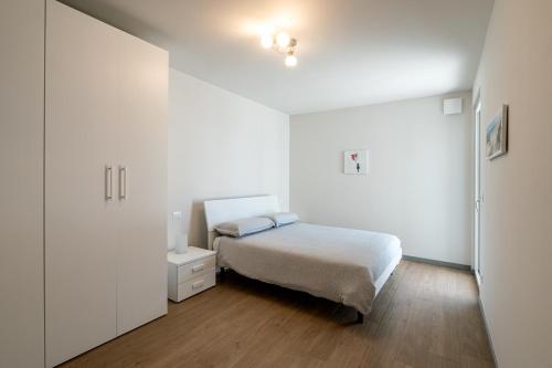 En eller flere senge i et værelse på Appartamenti Giotto