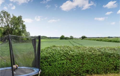 a view of a field and a golf net at 3 Bedroom Beautiful Home In Fjälkinge in Fjälkinge