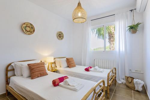 Postel nebo postele na pokoji v ubytování Casa de los Suenos