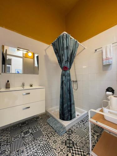 a bathroom with a shower curtain and a sink at Dream Escape in Santa Cruz de Tenerife