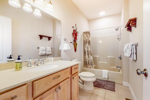 a bathroom with a sink and a toilet and a shower at Saco River & White Mountain Views in Conway