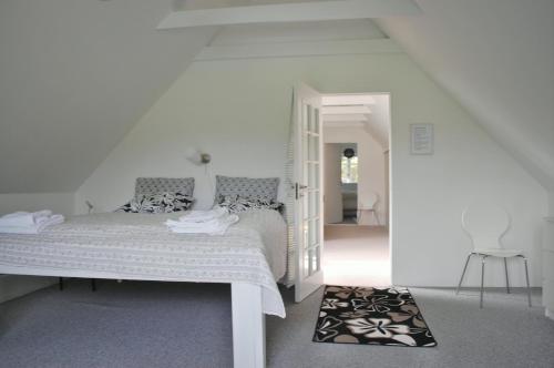 Un pat sau paturi într-o cameră la Fredensborg Guesthouse
