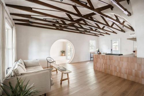 a living room with a couch and a table at Casa Terra Lumi - at lumicollection in Fort Lauderdale