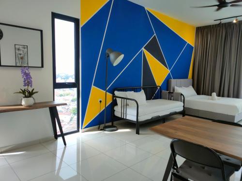 a living room with a large mural on the wall at New 2BR Georgetown Warm and Lovely Homestay 10pax-无敌美景两房民宿 Beacon Executive Suite in George Town
