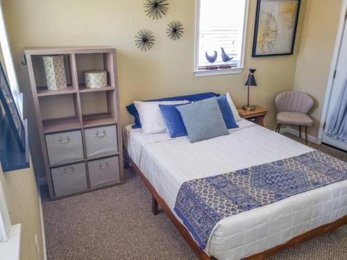 a bedroom with a bed and a book shelf at RETRO RETREAT in DTSP - Explore the downtown area in St Petersburg