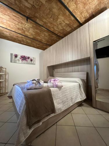 a bedroom with a bed with two pillows on it at L' anfora Locazione Turistica in Terni