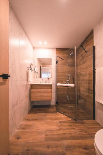 a bathroom with a shower and a sink at Fully Serviced Apartment at Regatta Living - 2C in Santo Domingo