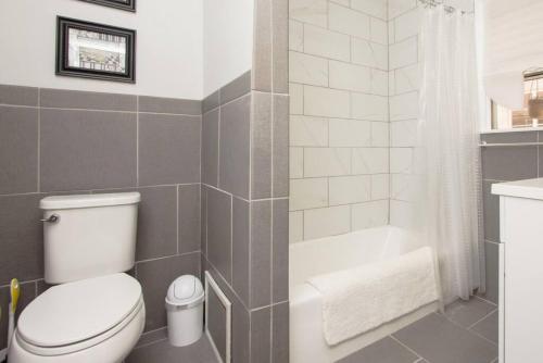 a bathroom with a toilet and a bath tub at Cool and Cozy Pad Close to Everything in Los Angeles