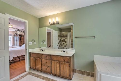 a bathroom with a sink and a mirror at Pet-Friendly Lawrenceville House with Deck! in Lawrenceville