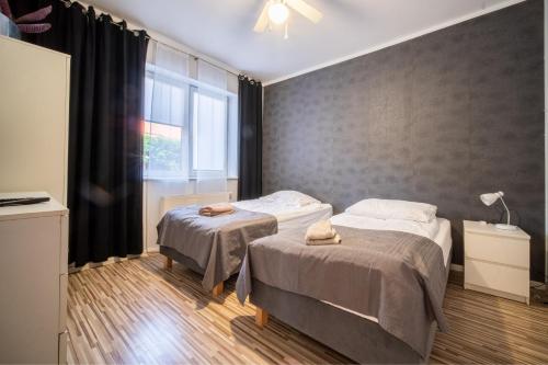 Posteľ alebo postele v izbe v ubytovaní Dom na Mazurach LUNA HAUS